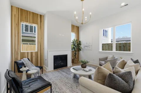 a kitchen with stainless steel appliances granite countertop a stove a kitchen island a stove and a wooden floor