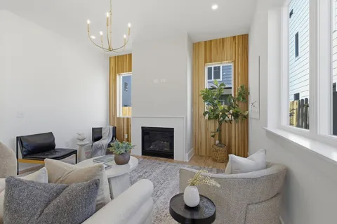 a kitchen with stainless steel appliances a stove a sink and a refrigerator
