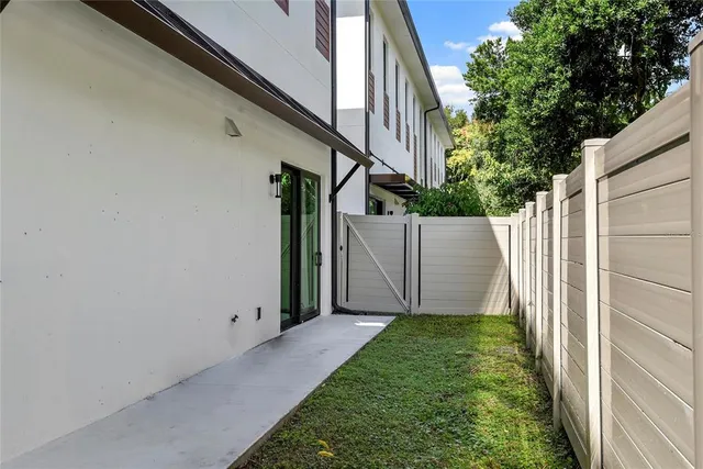 a view of a backyard with pathway