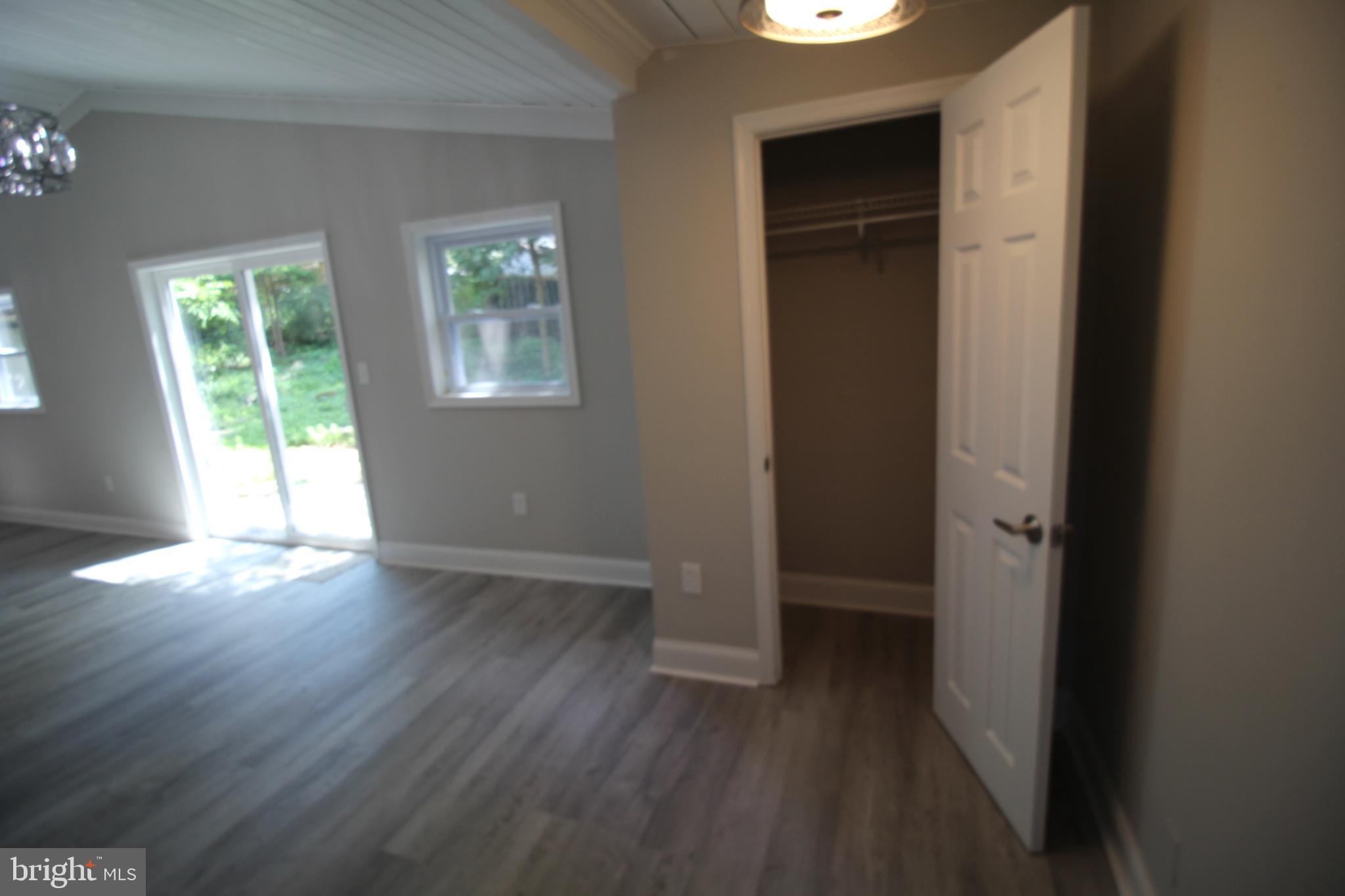 2704 Harris Avenue Silver Spring, MD 20902 - Photo 3 of 24 an empty room with wooden floor and windows