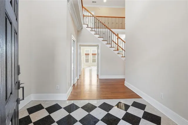 a view of a hallway with a black and white checkered floor