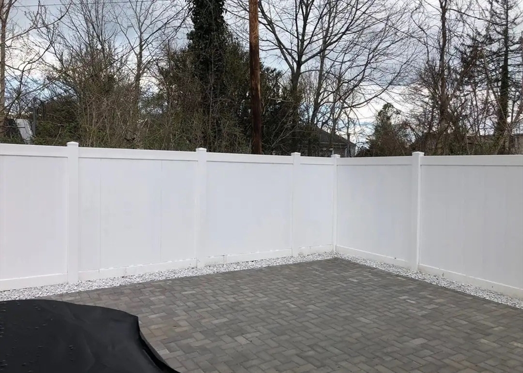 65 Louis Street, Unit A Barnstable, MA 02601 - Photo 25 of 28 a view of wooden floor and trees