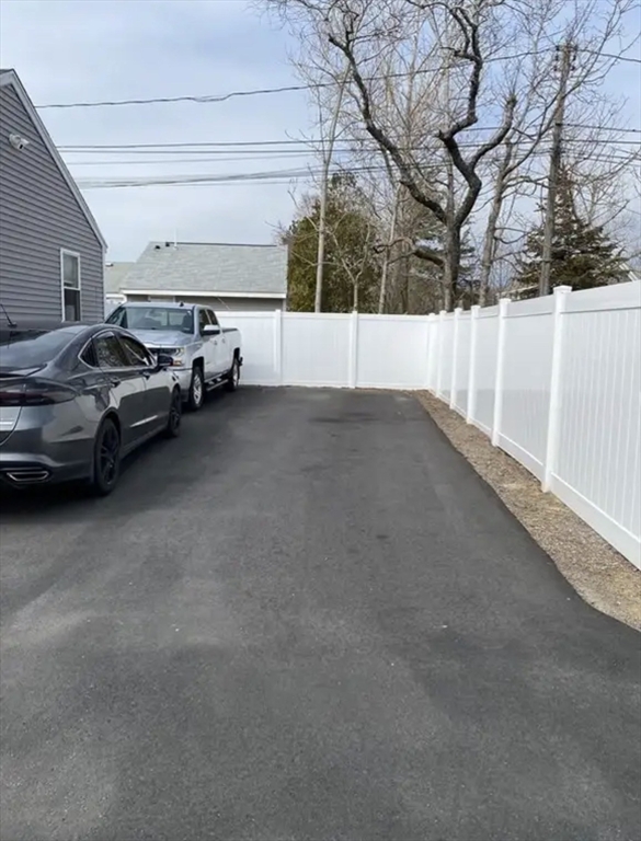 65 Louis Street, Unit A Barnstable, MA 02601 - Photo 28 of 28 a view of parking space and car parked