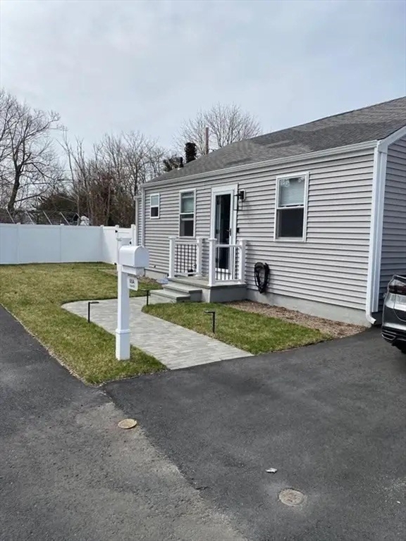 65 Louis Street, Unit A Barnstable, MA 02601 - Photo 3 of 28 a view of a house with backyard and sitting area
