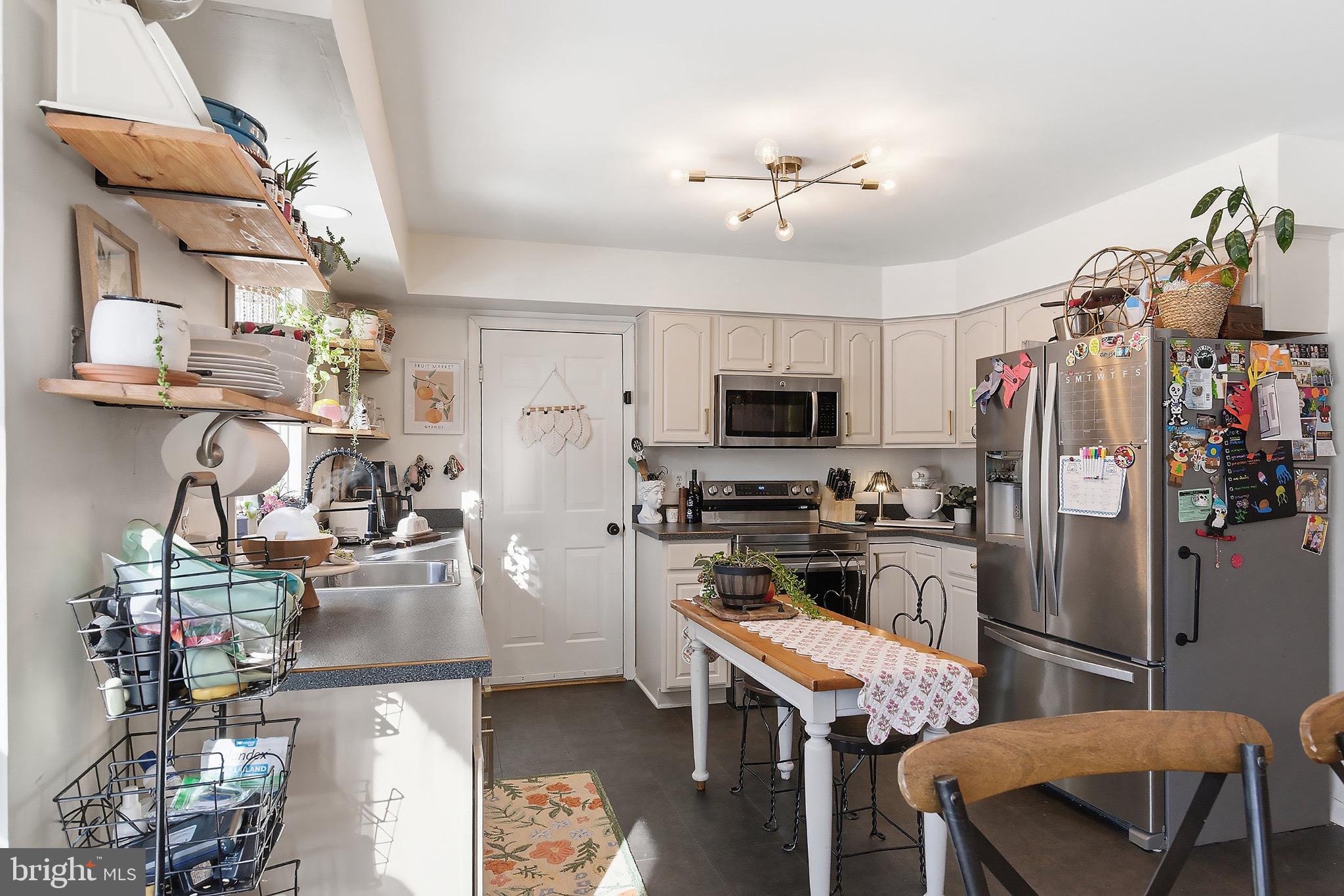 128 Highway 72 Vincentown, NJ 08088 - Photo 14 of 32 a kitchen with stainless steel appliances granite countertop a stove refrigerator and microwave