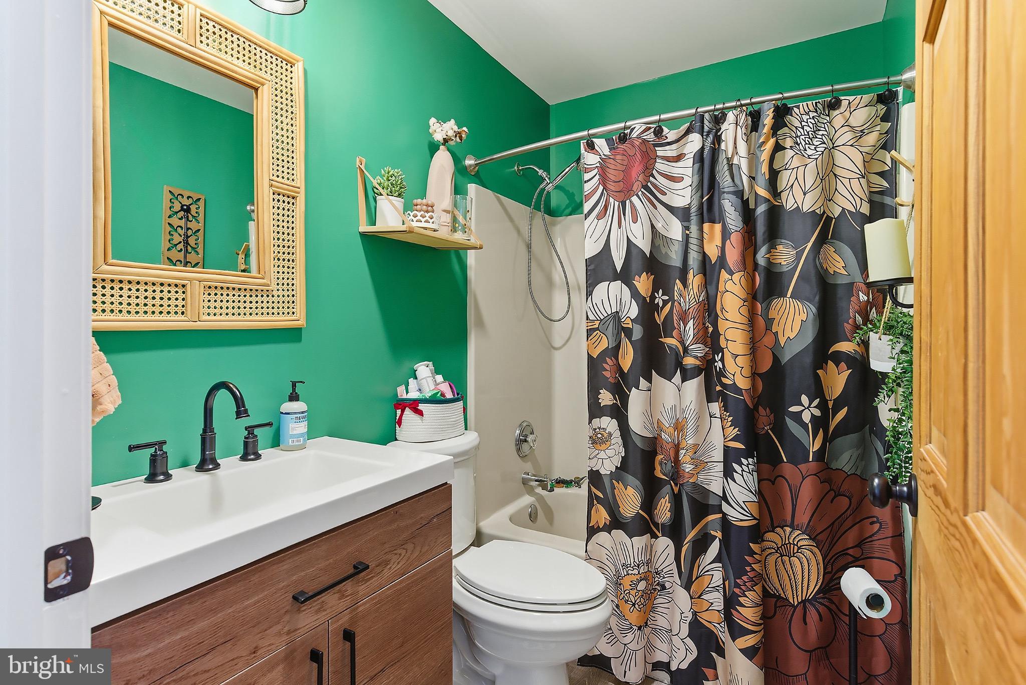 128 Highway 72 Vincentown, NJ 08088 - Photo 18 of 32 a bathroom with a sink and mirror with toilet