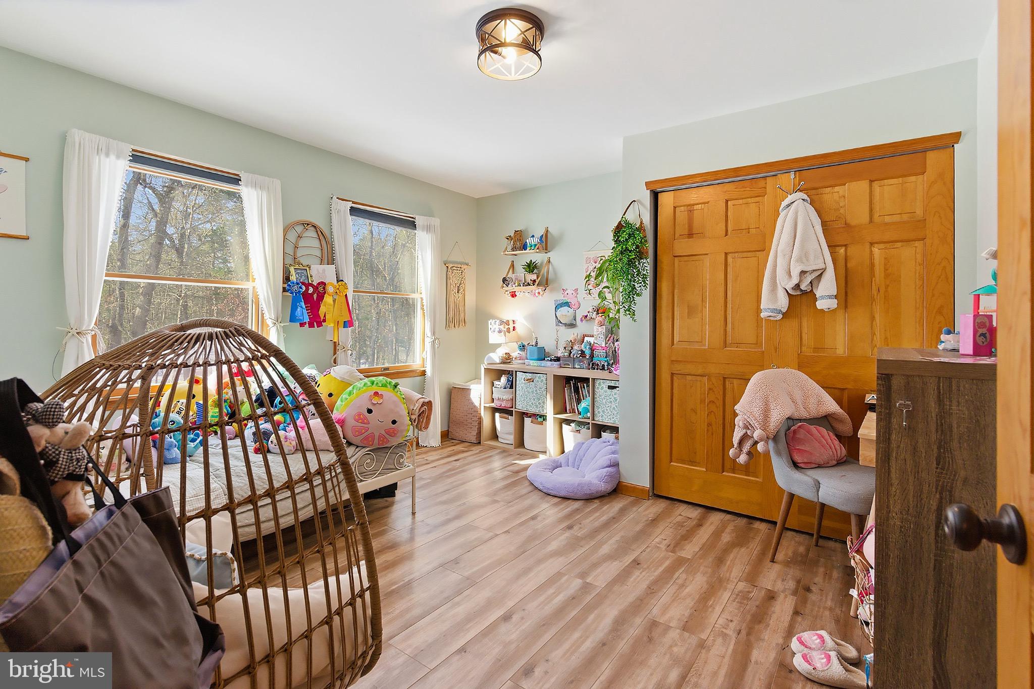128 Highway 72 Vincentown, NJ 08088 - Photo 19 of 32 a bedroom with a bed and wooden floor