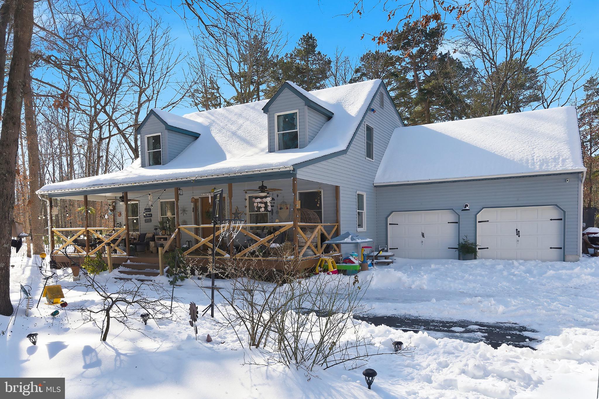128 Highway 72 Vincentown, NJ 08088 - Photo 2 of 32 a view of a patio with table and chairs under an umbrella