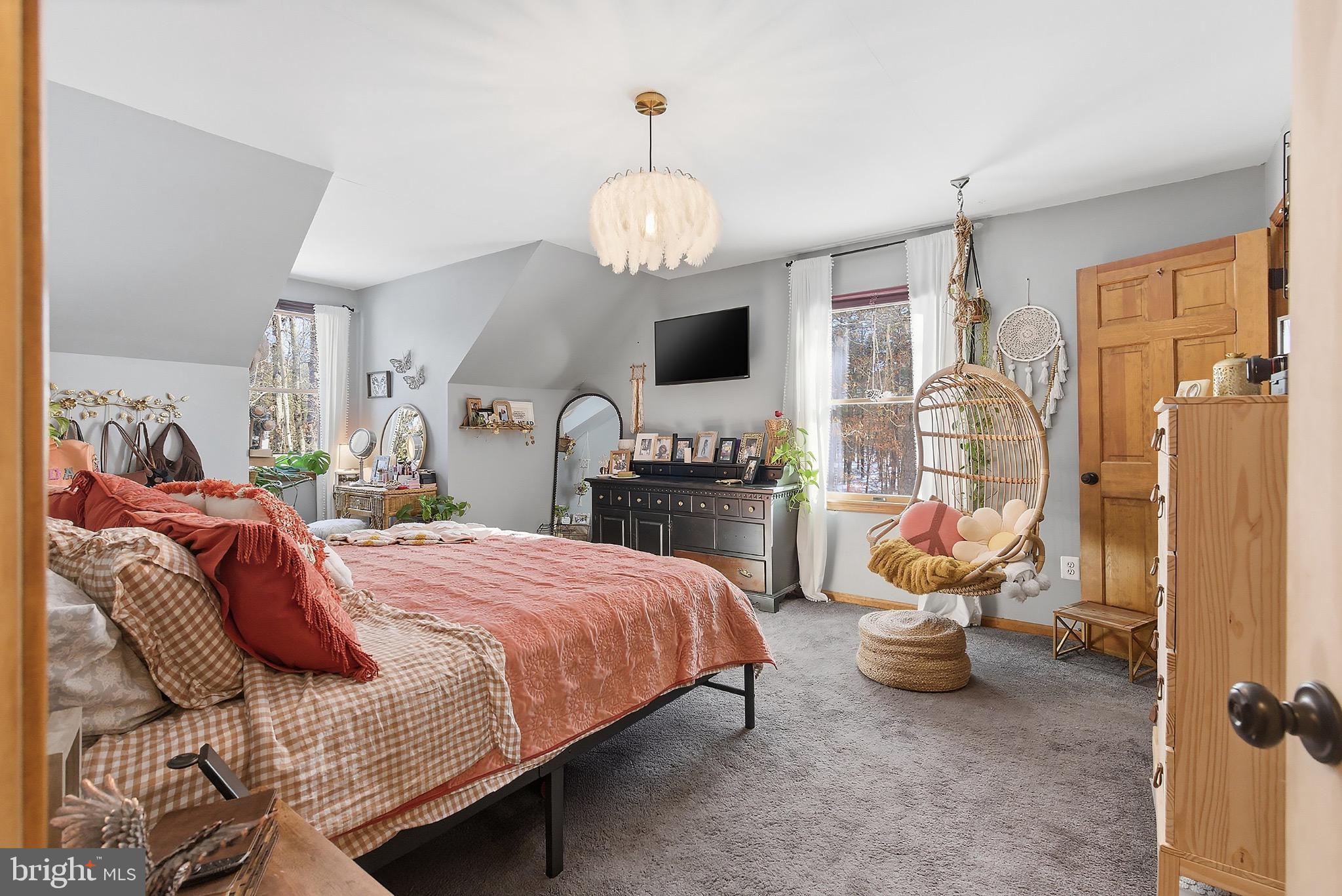 128 Highway 72 Vincentown, NJ 08088 - Photo 23 of 32 a bedroom with a bed and a chandelier