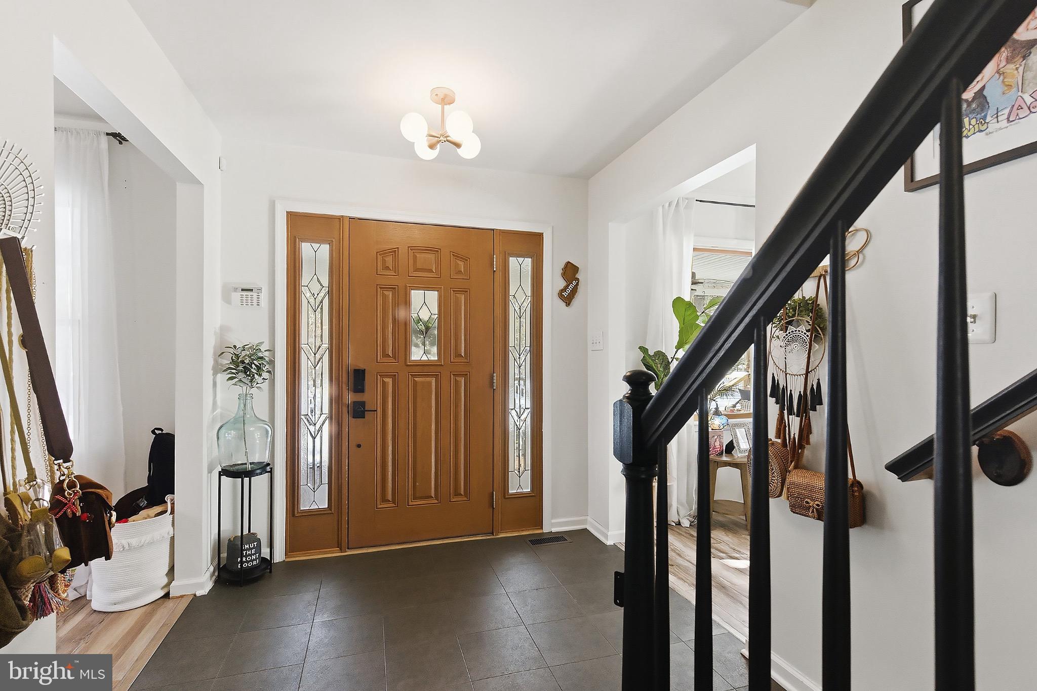 128 Highway 72 Vincentown, NJ 08088 - Photo 4 of 32 a view of an entryway with wooden floor and stairs