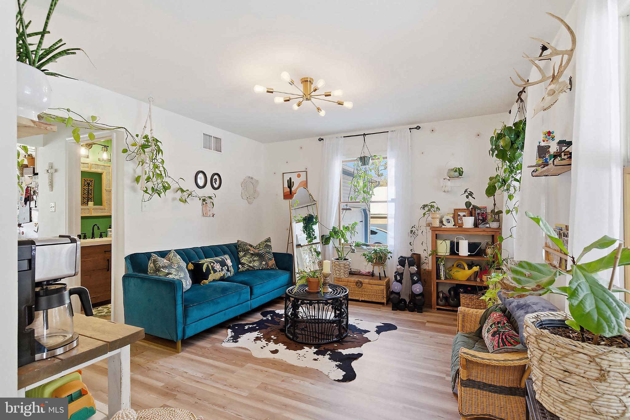 128 Highway 72 Vincentown, NJ 08088 - Photo 6 of 32 a living room with furniture and flowers