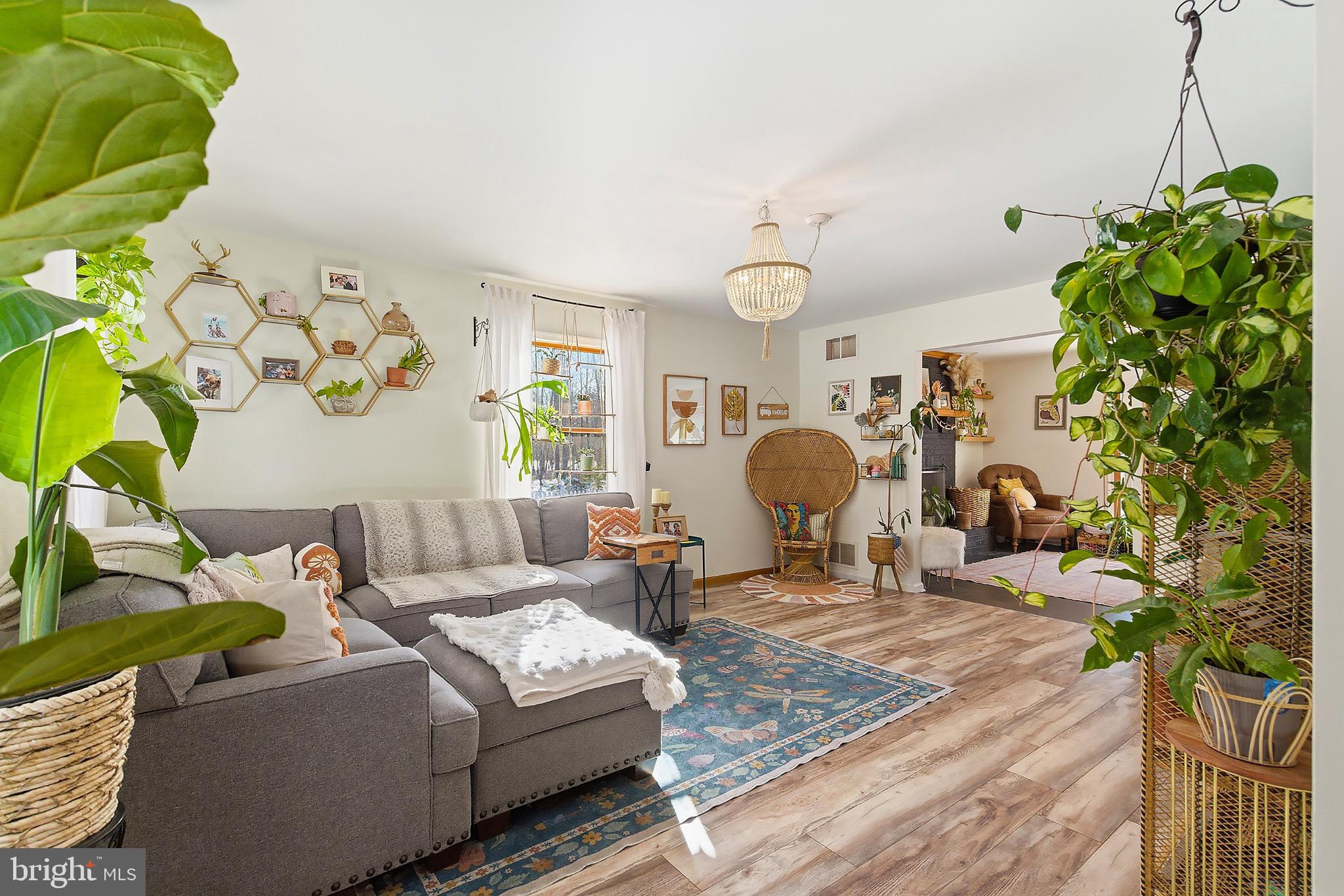 128 Highway 72 Vincentown, NJ 08088 - Photo 8 of 32 a living room with furniture and a chandelier