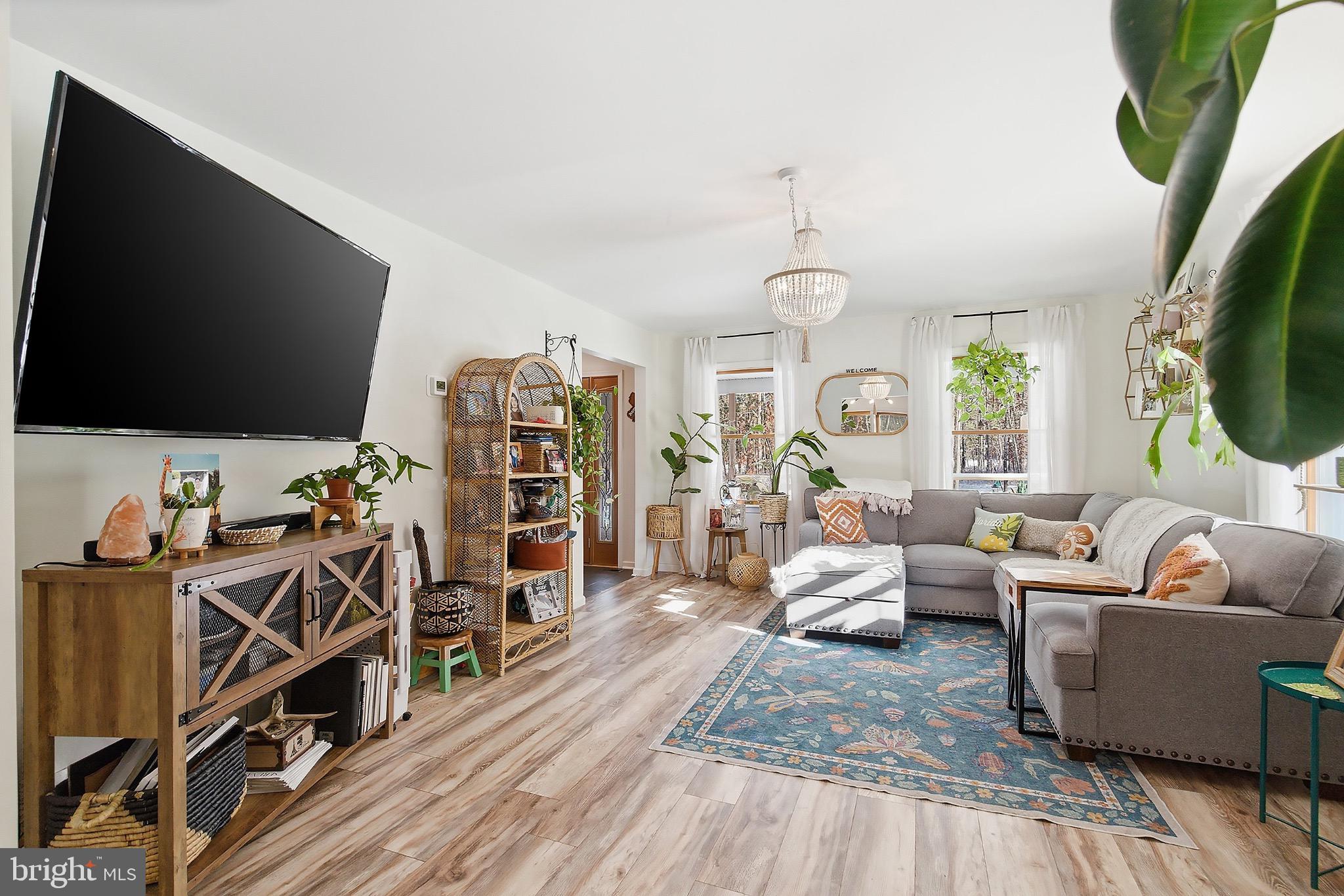 128 Highway 72 Vincentown, NJ 08088 - Photo 9 of 32 a living room with furniture and a flat screen tv