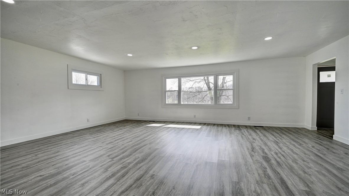 3265 York View Road Southwest New Philadelphia, OH 44663 - Photo 10 of 45 Unfurnished room featuring wood finished floors and recessed lighting
