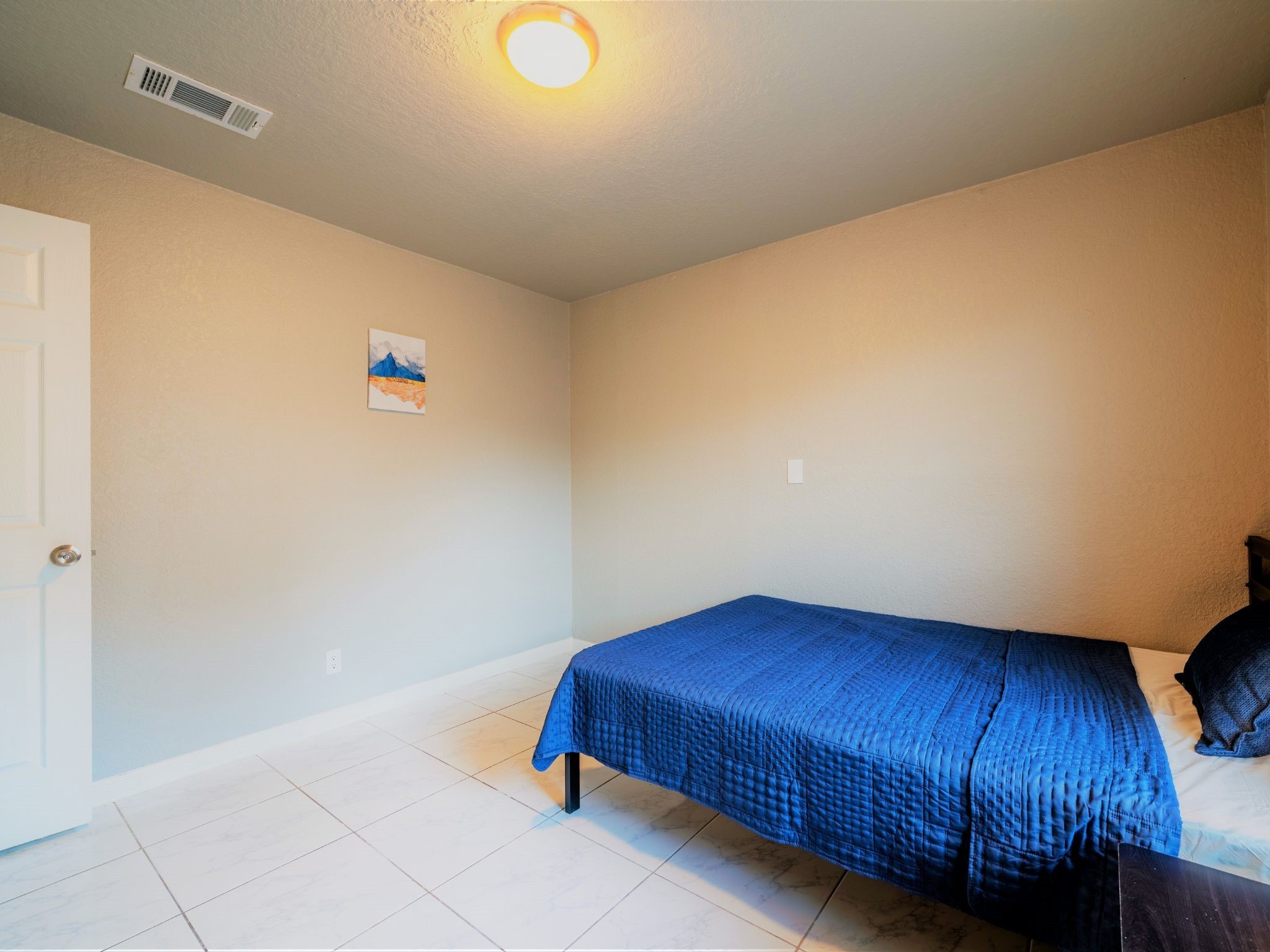 428 Gans Street Houston, TX 77029 - Photo 14 of 23 Clean and modern bedroom with smooth flooring, overhead lighting, and room for a full-sized bed setup.