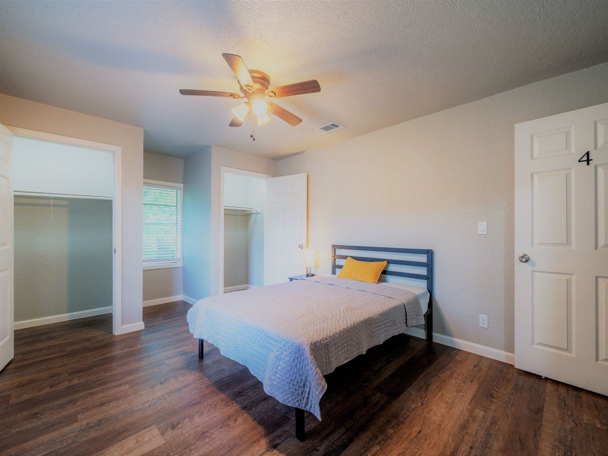 428 Gans Street Houston, TX 77029 - Photo 16 of 23 Spacious primary bedroom with a ceiling fan and walk-in closet access. Ready for your personal touches.