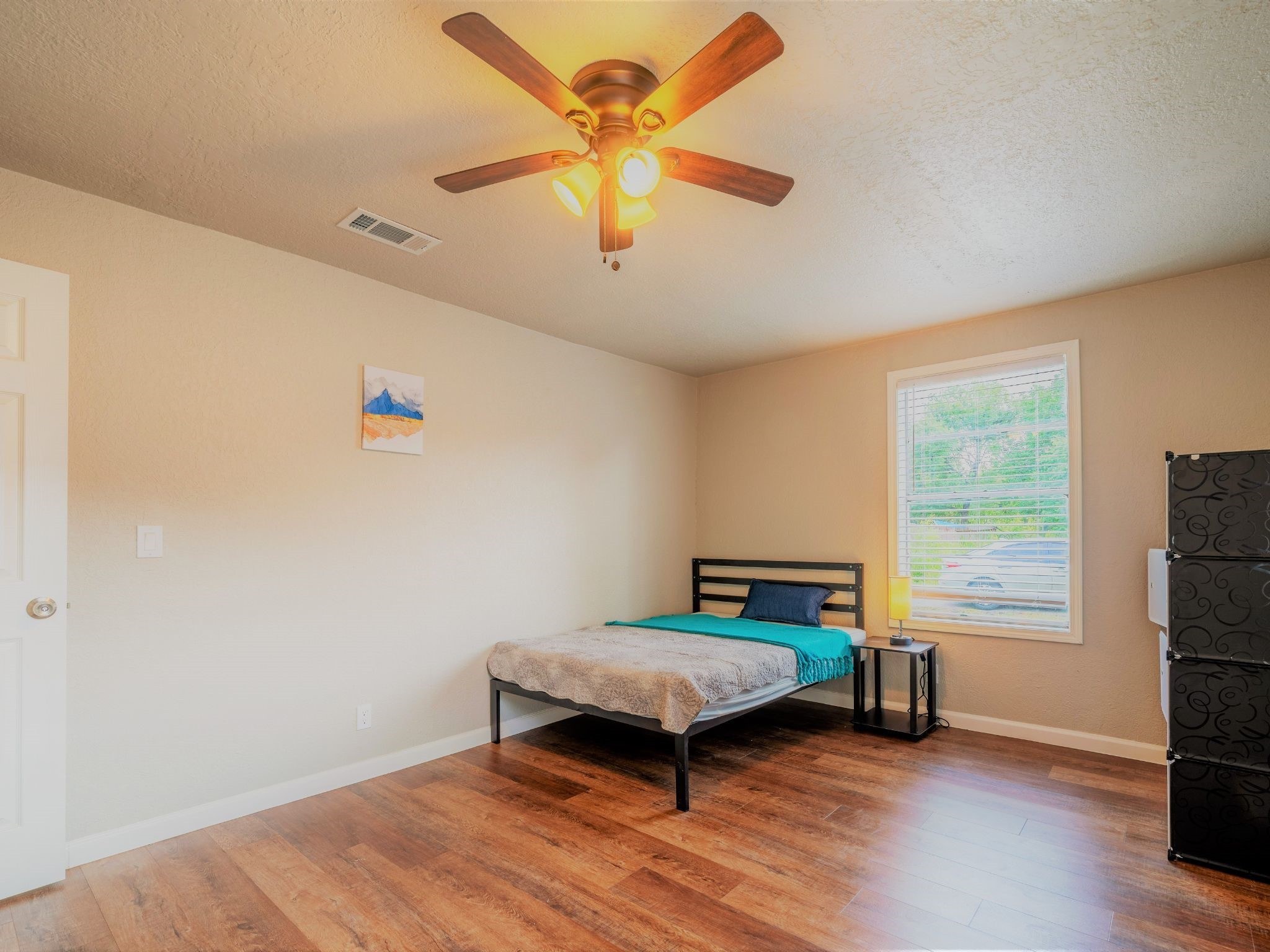 428 Gans Street Houston, TX 77029 - Photo 18 of 23 Sunny bedroom with ceiling fan and corner window views. Great airflow and natural light throughout.