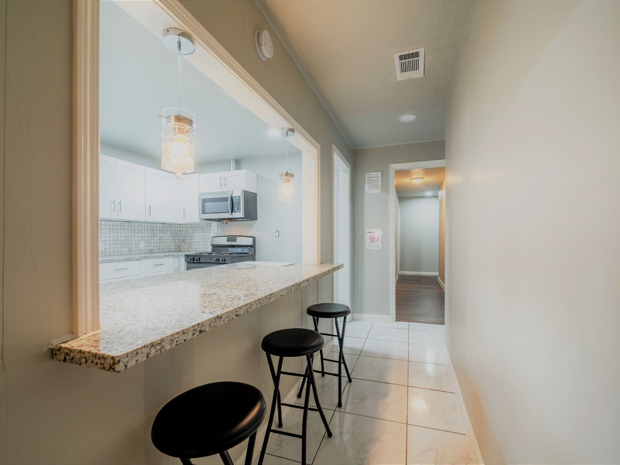 428 Gans Street Houston, TX 77029 - Photo 2 of 23 Modern kitchen with updated appliances, sleek cabinetry, and recessed lighting. A functional layout ideal for everyday cooking and entertaining.