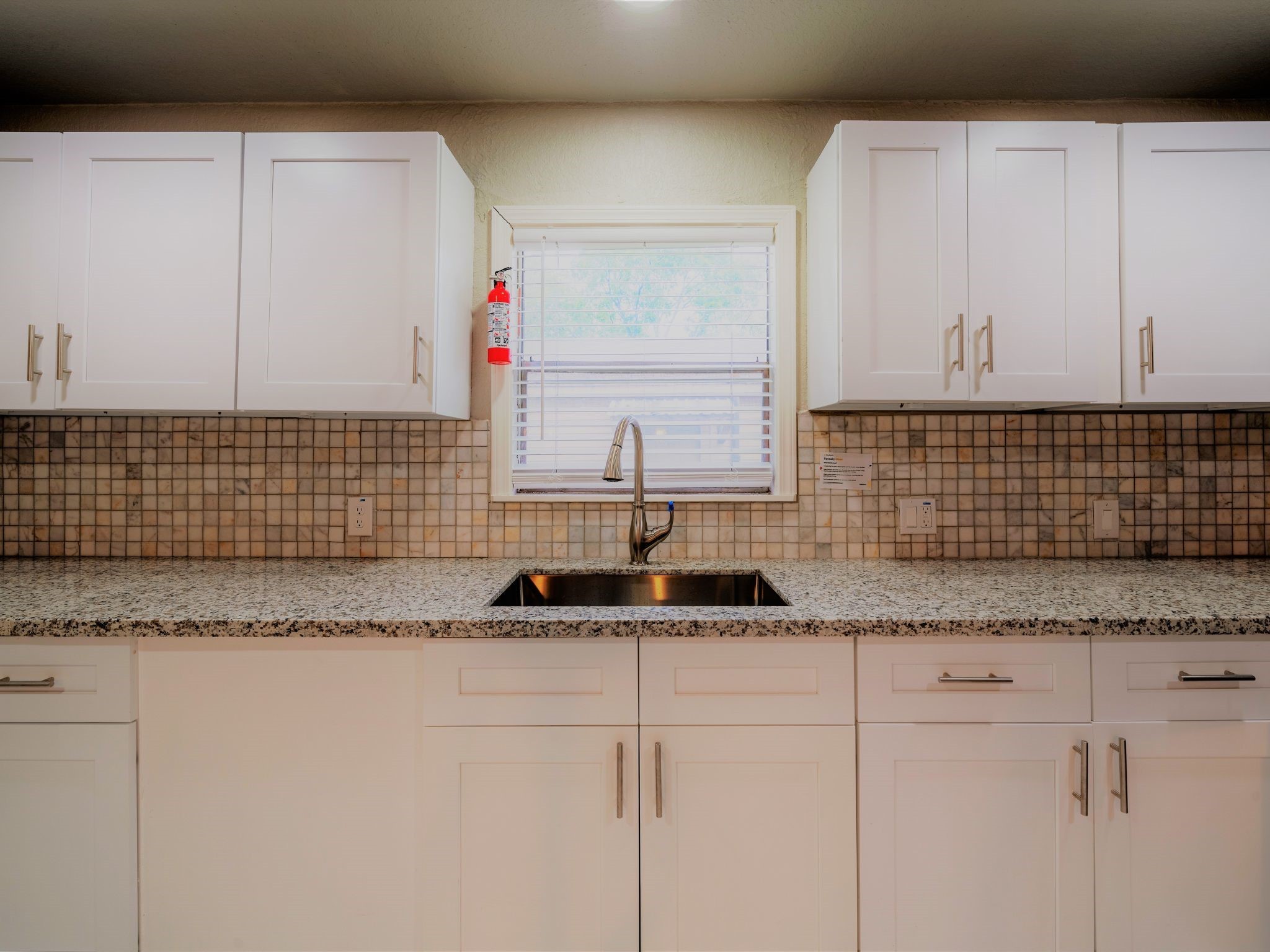 428 Gans Street Houston, TX 77029 - Photo 6 of 23 Generous storage space in this laundry area or utility room, with built-in cabinets and modern finishes.
