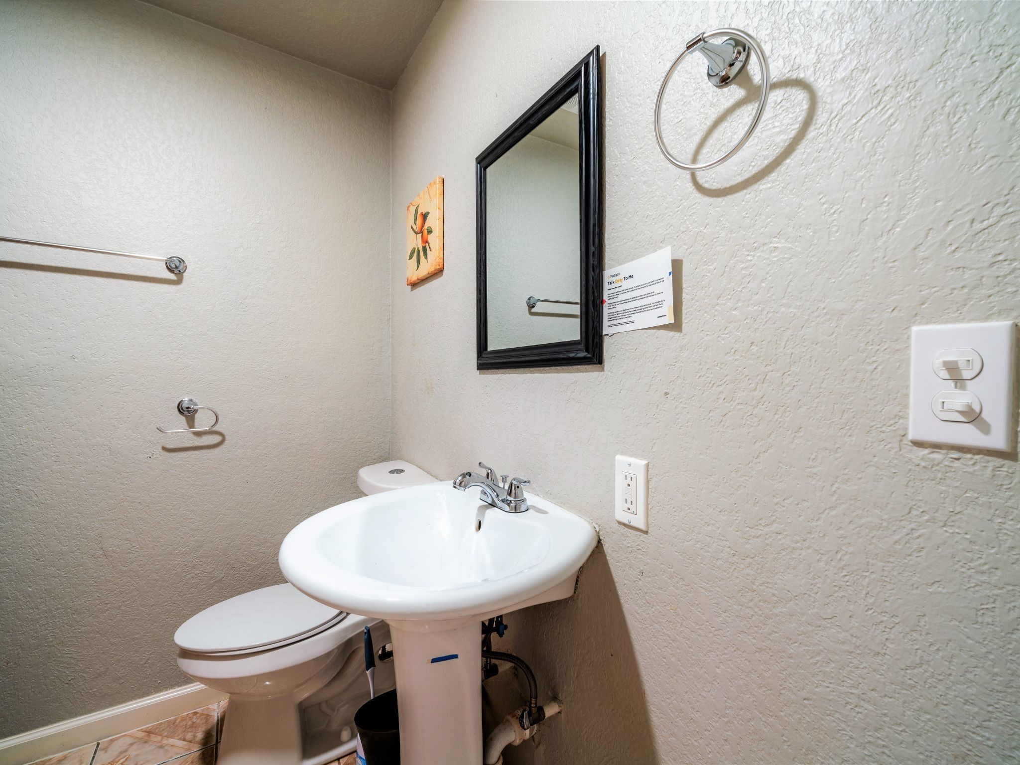 428 Gans Street Houston, TX 77029 - Photo 7 of 23 Compact powder room with pedestal sink and overhead mirror—perfect for guests or daily convenience.