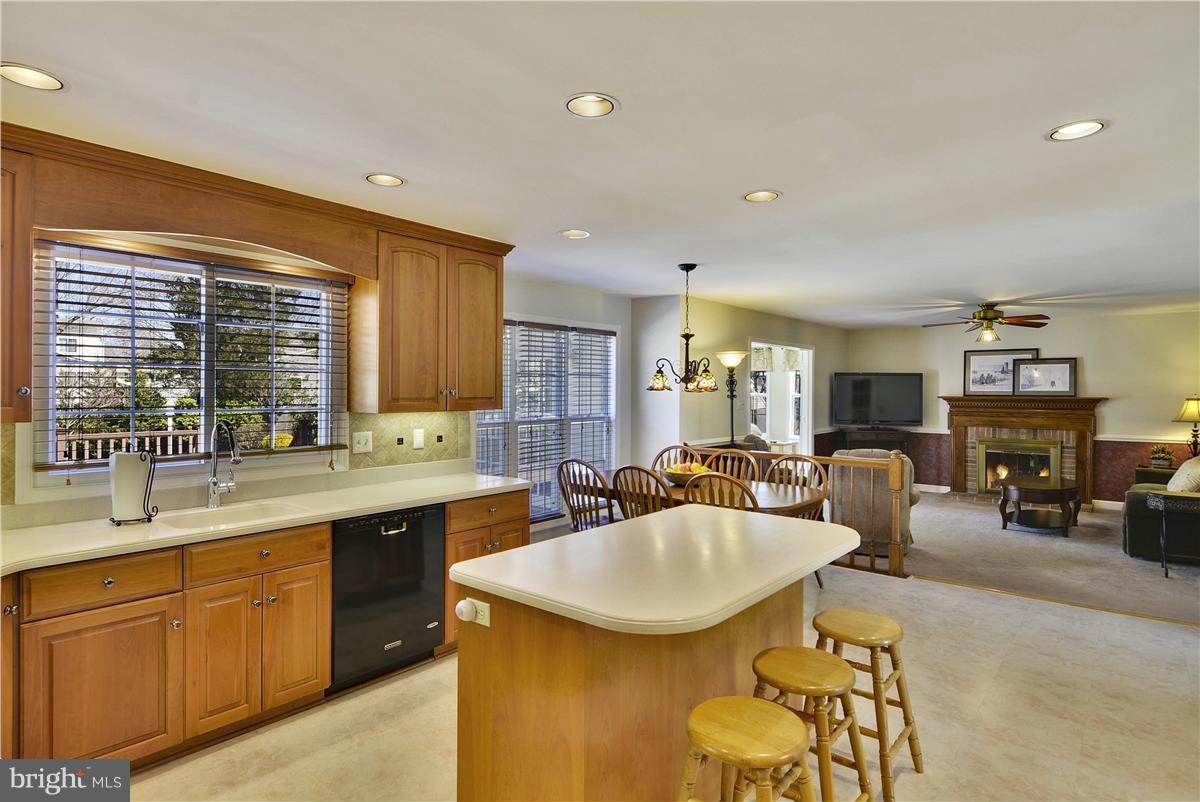 19107 Munger Farm Road Poolesville, MD 20837 - Photo 8 of 30 a kitchen with center island table and chairs