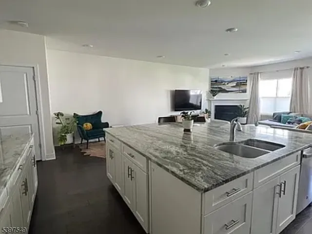 a kitchen with a sink and a stove top oven