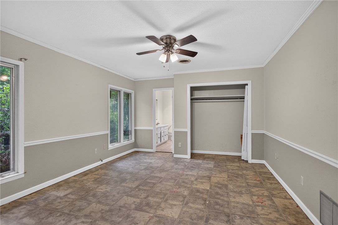 123 Robin Road Westminster, SC 29693 - Photo 27 of 50 A spacious room offers ample natural light and a ready-to-customize interior with a ceiling fan.
