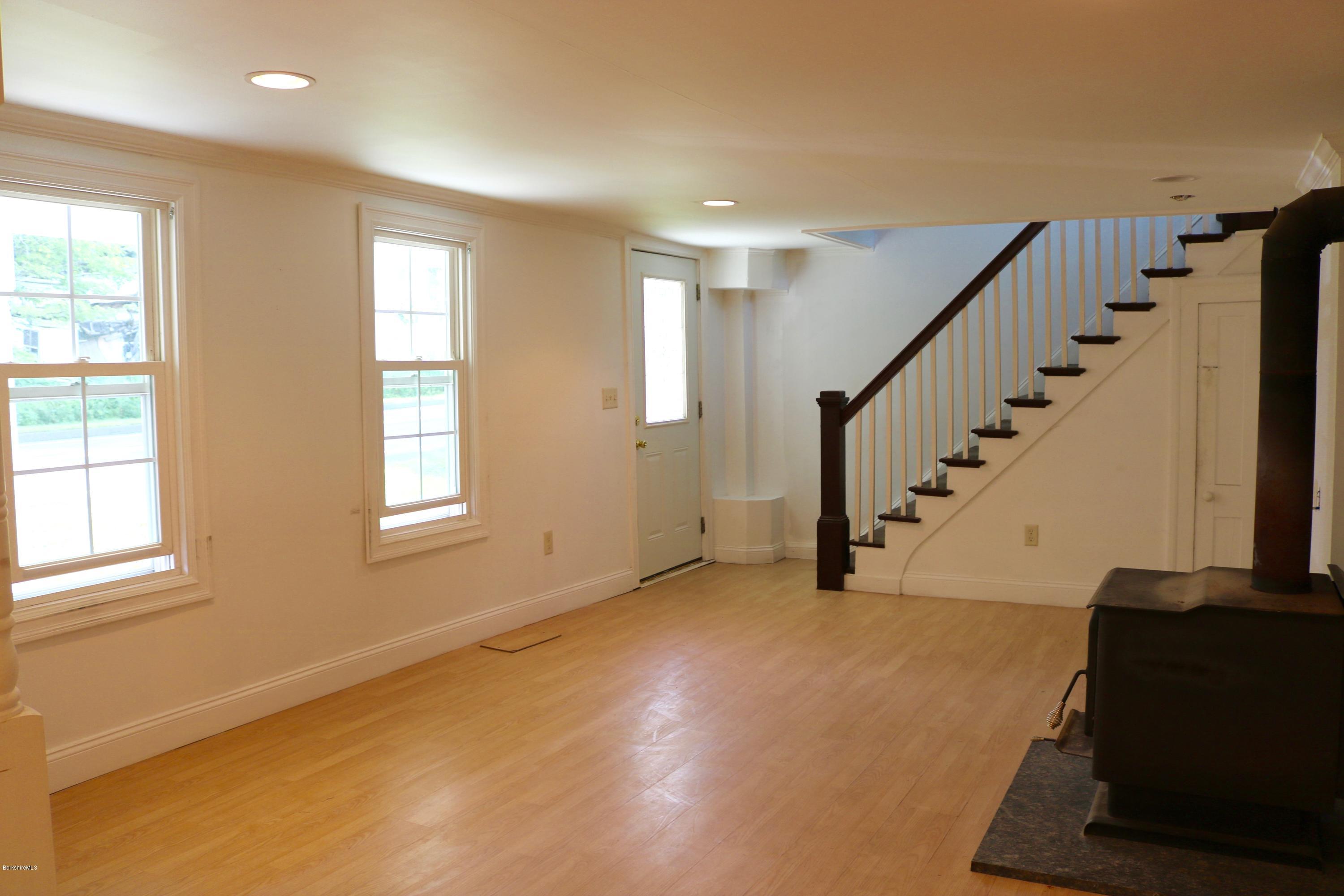 87 South Main Road Otis, MA 01253 - Photo 12 of 35 a view of an empty room with wooden floor and a window