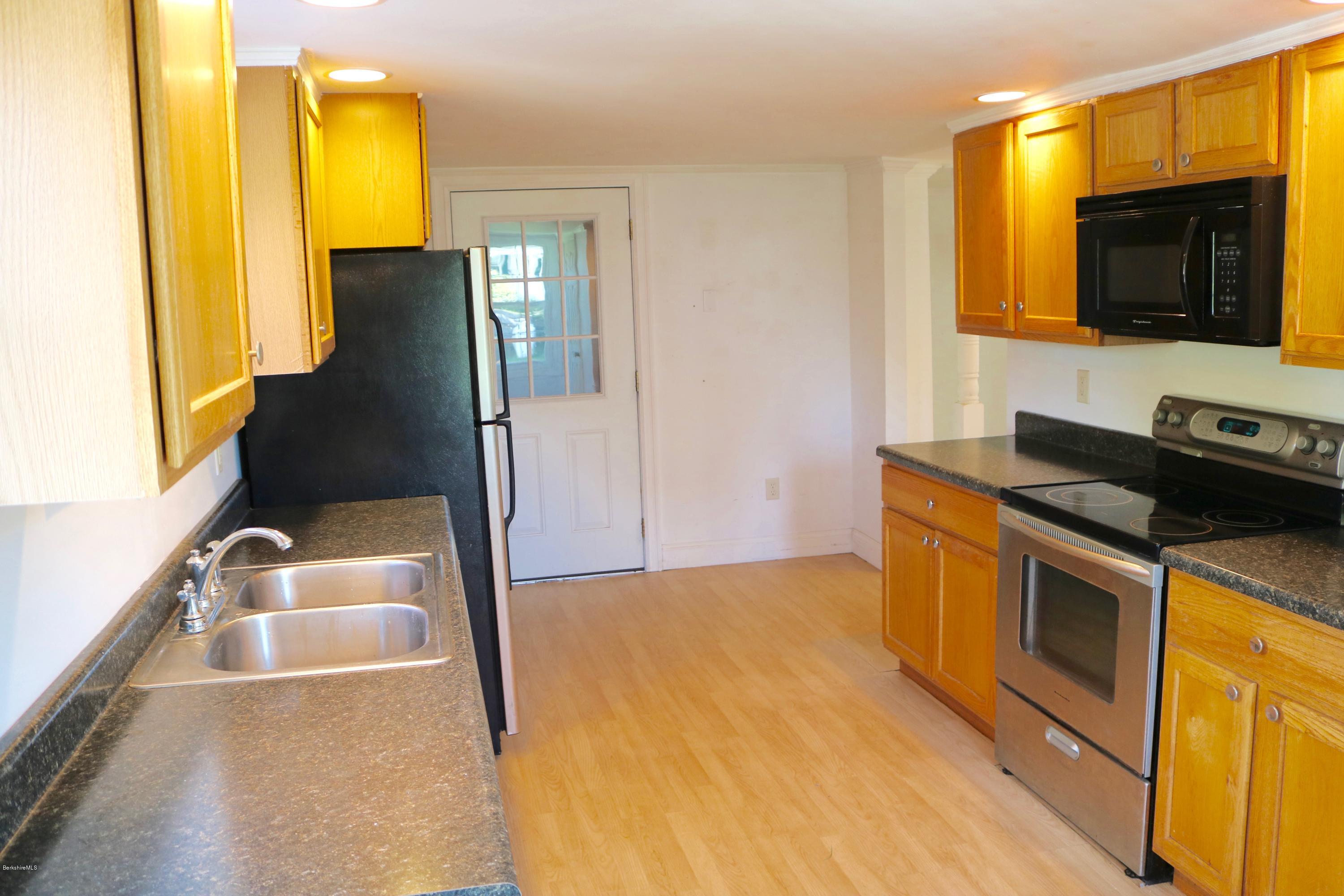 87 South Main Road Otis, MA 01253 - Photo 13 of 35 a kitchen with a sink and a refrigerator