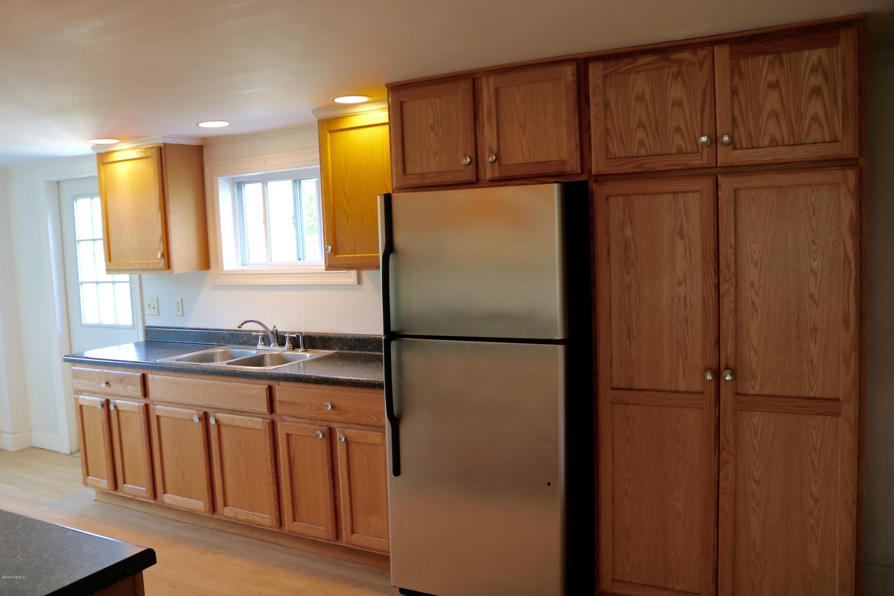 87 South Main Road Otis, MA 01253 - Photo 15 of 35 a white refrigerator freezer sitting in a kitchen