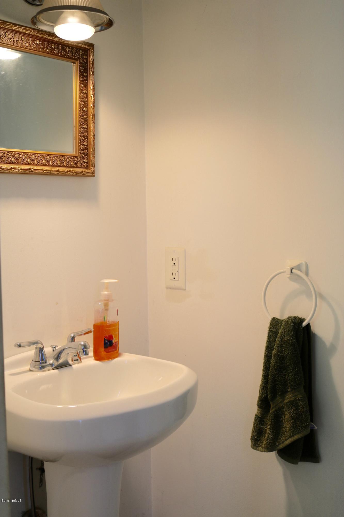 87 South Main Road Otis, MA 01253 - Photo 19 of 35 a bathroom with a sink and a mirror