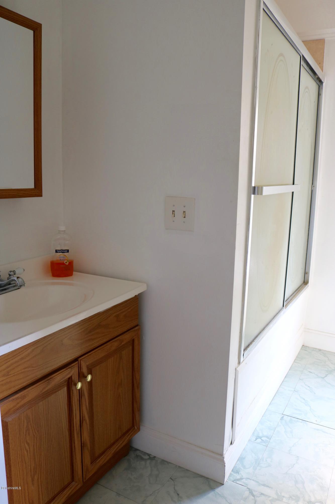 87 South Main Road Otis, MA 01253 - Photo 30 of 35 a utility room with cabinets washer and dryer