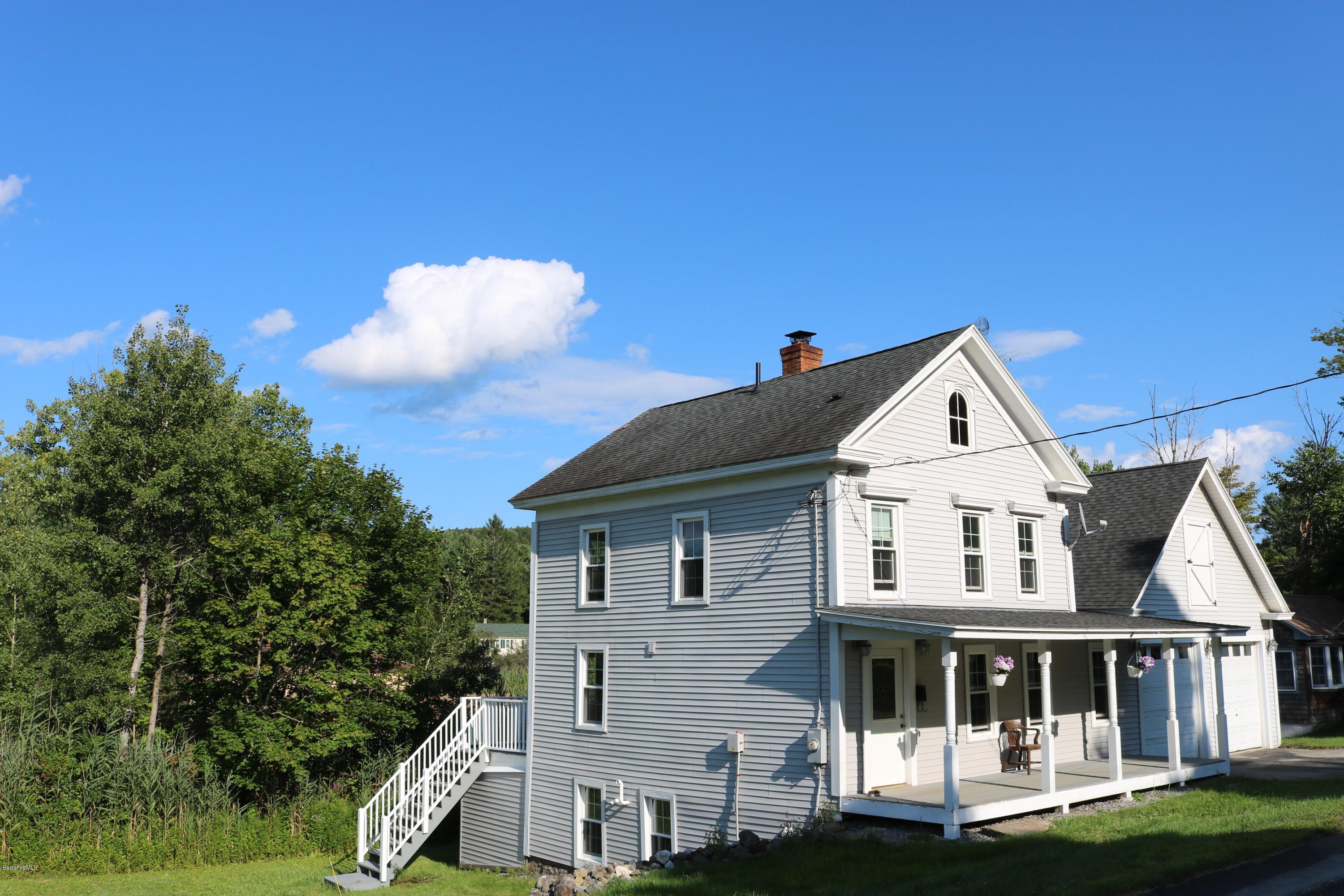 87 South Main Road Otis, MA 01253 - Photo 5 of 35 a front view of a house with a yard