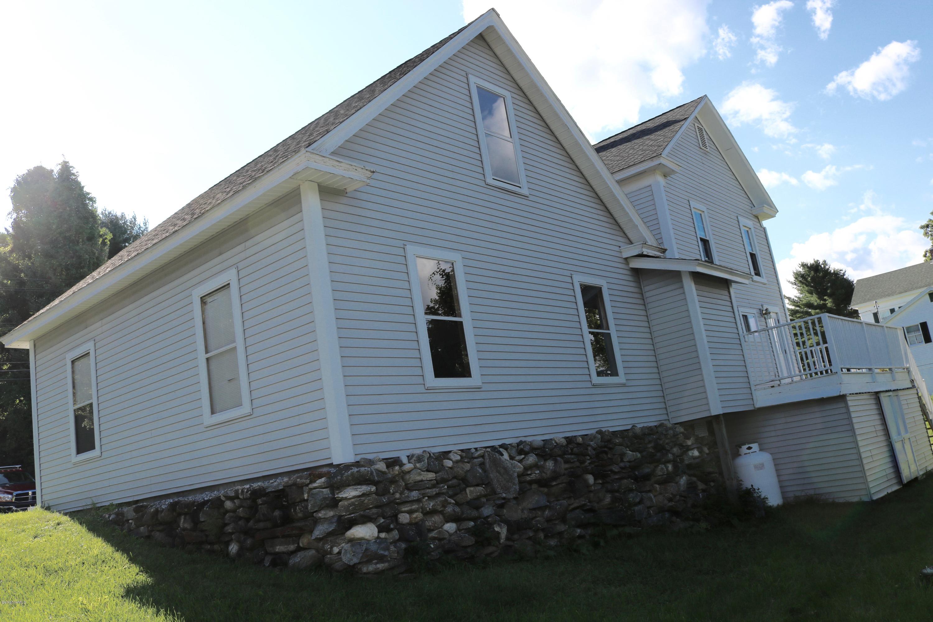 87 South Main Road Otis, MA 01253 - Photo 9 of 35 a view of a house with a yard