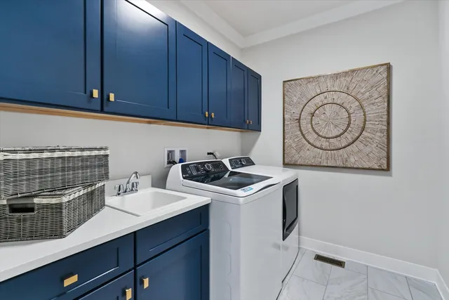 a view of a kitchen with sink and cabinets