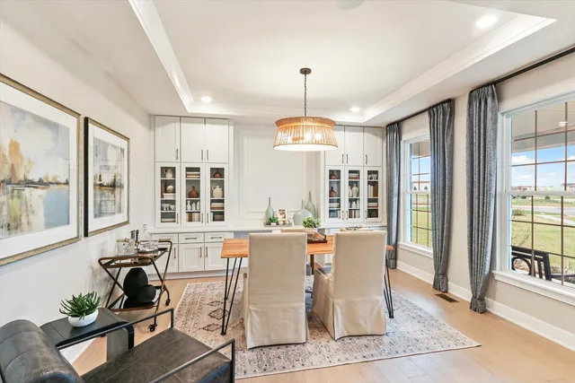 a view of a dining room with furniture window and outside view