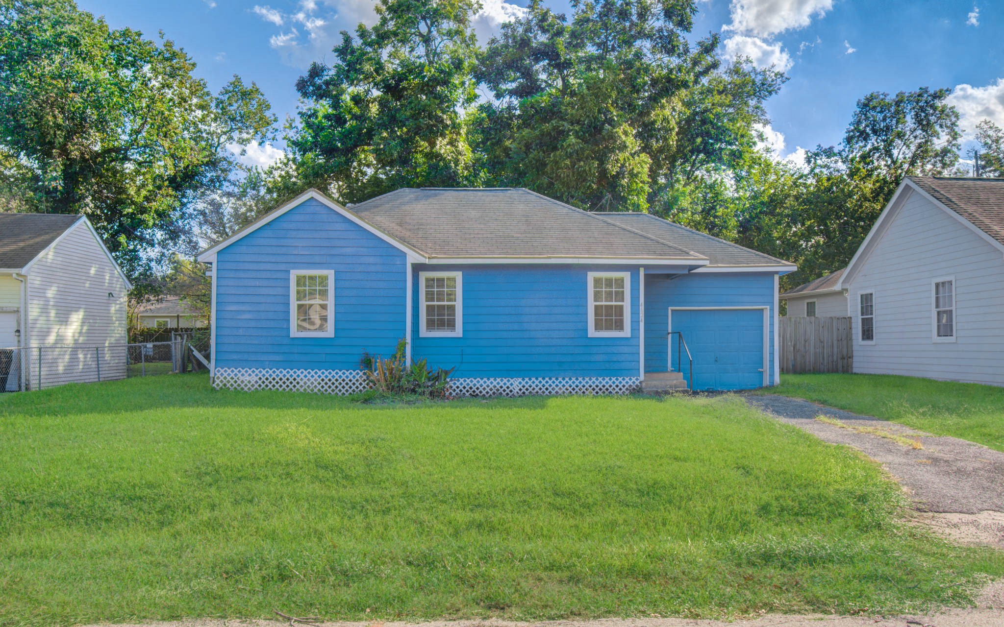 4624 Kingsbury Street Houston, TX 77021 - Photo 1 of 31 a view of a yard in front of a house with large trees
