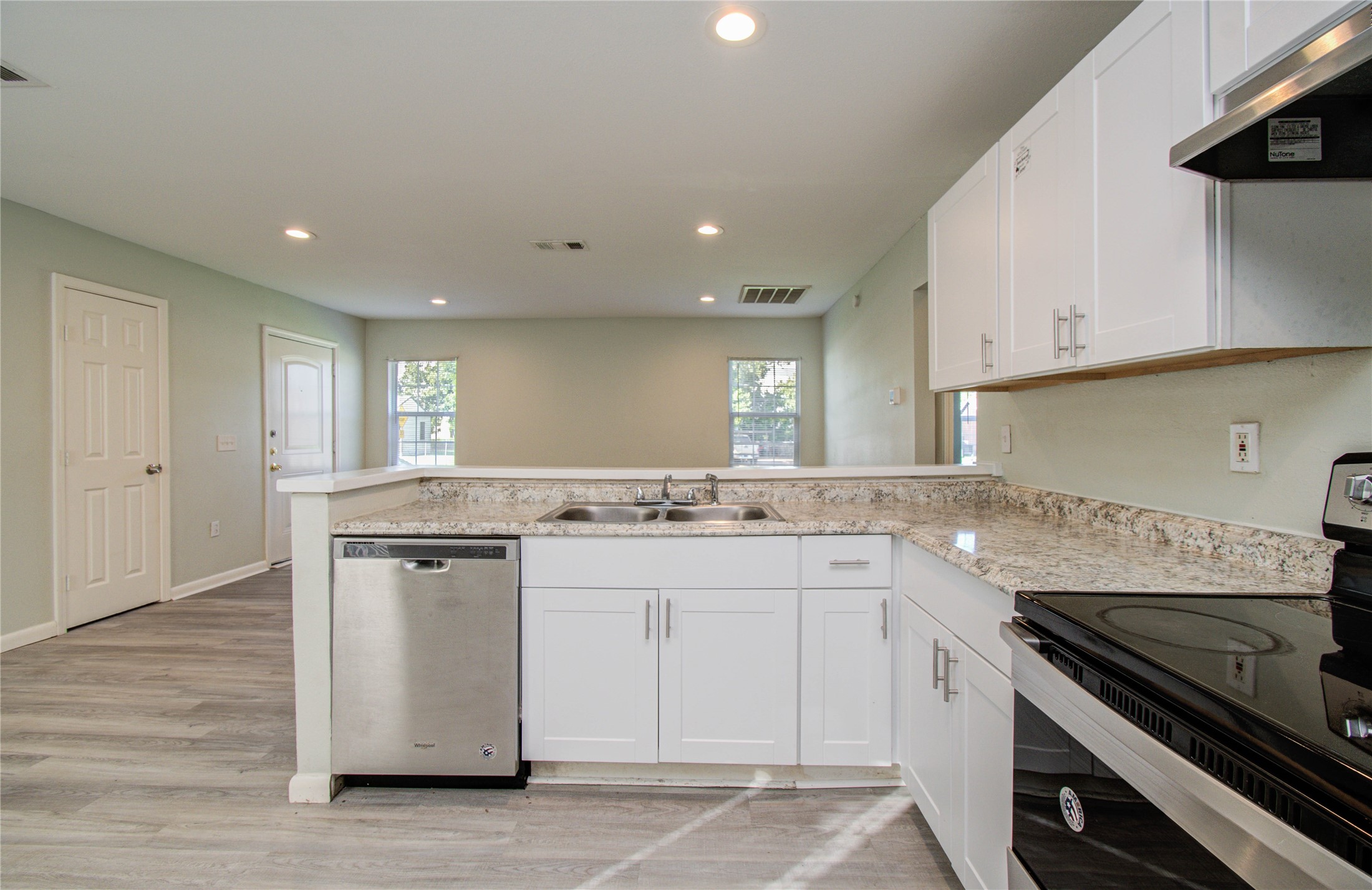 4624 Kingsbury Street Houston, TX 77021 - Photo 13 of 31 a kitchen with stainless steel appliances granite countertop a sink stove and cabinets