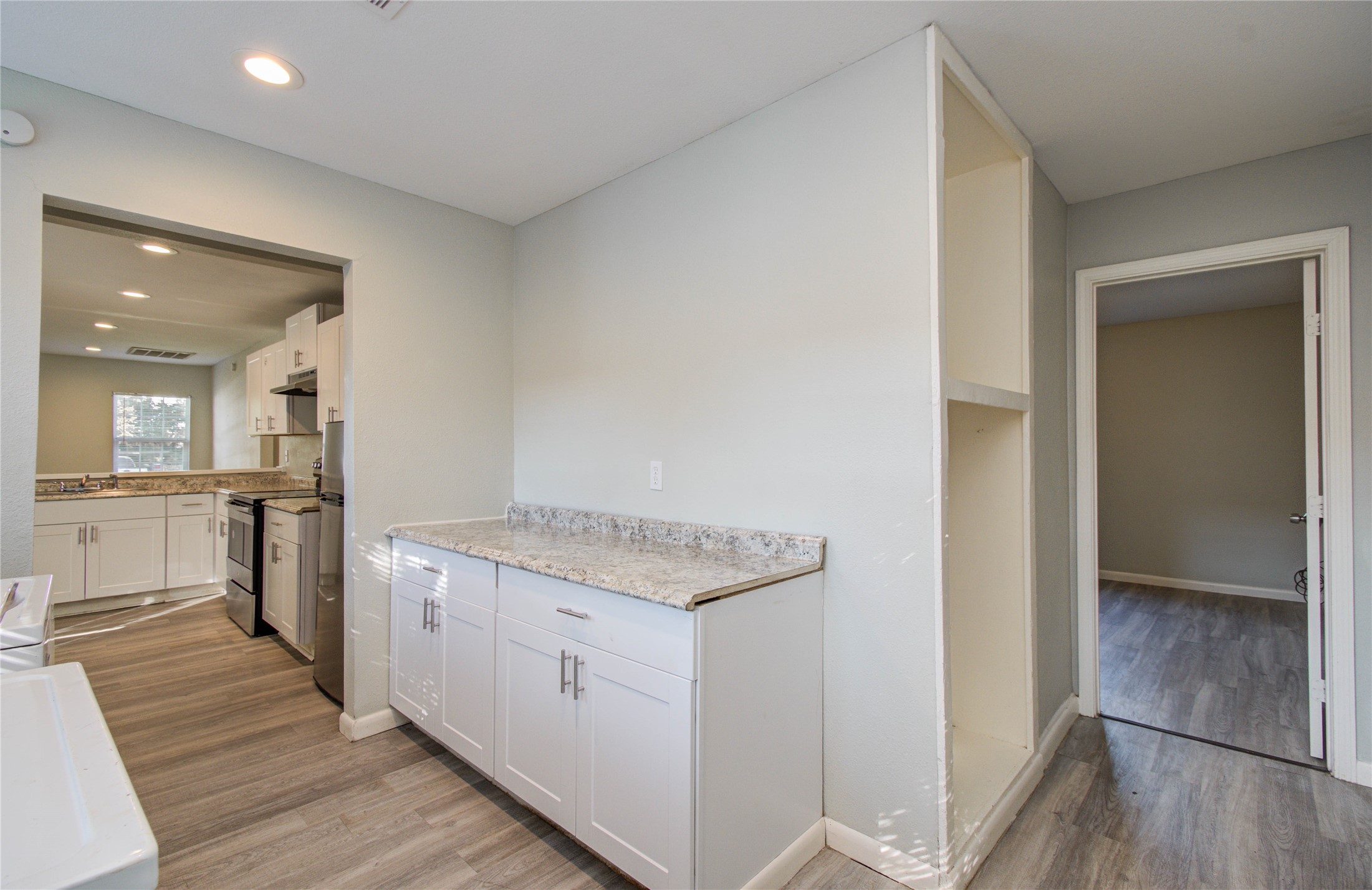 4624 Kingsbury Street Houston, TX 77021 - Photo 15 of 31 a view of a kitchen cabinets and wooden floor