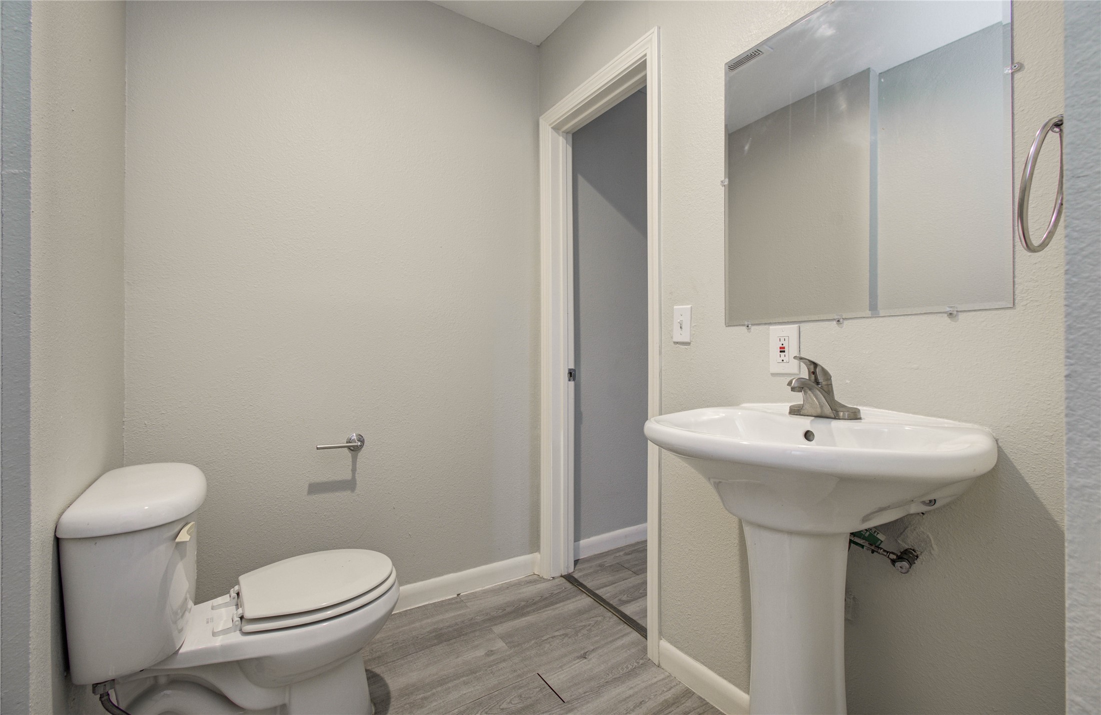 4624 Kingsbury Street Houston, TX 77021 - Photo 20 of 31 a bathroom with a sink toilet and a mirror