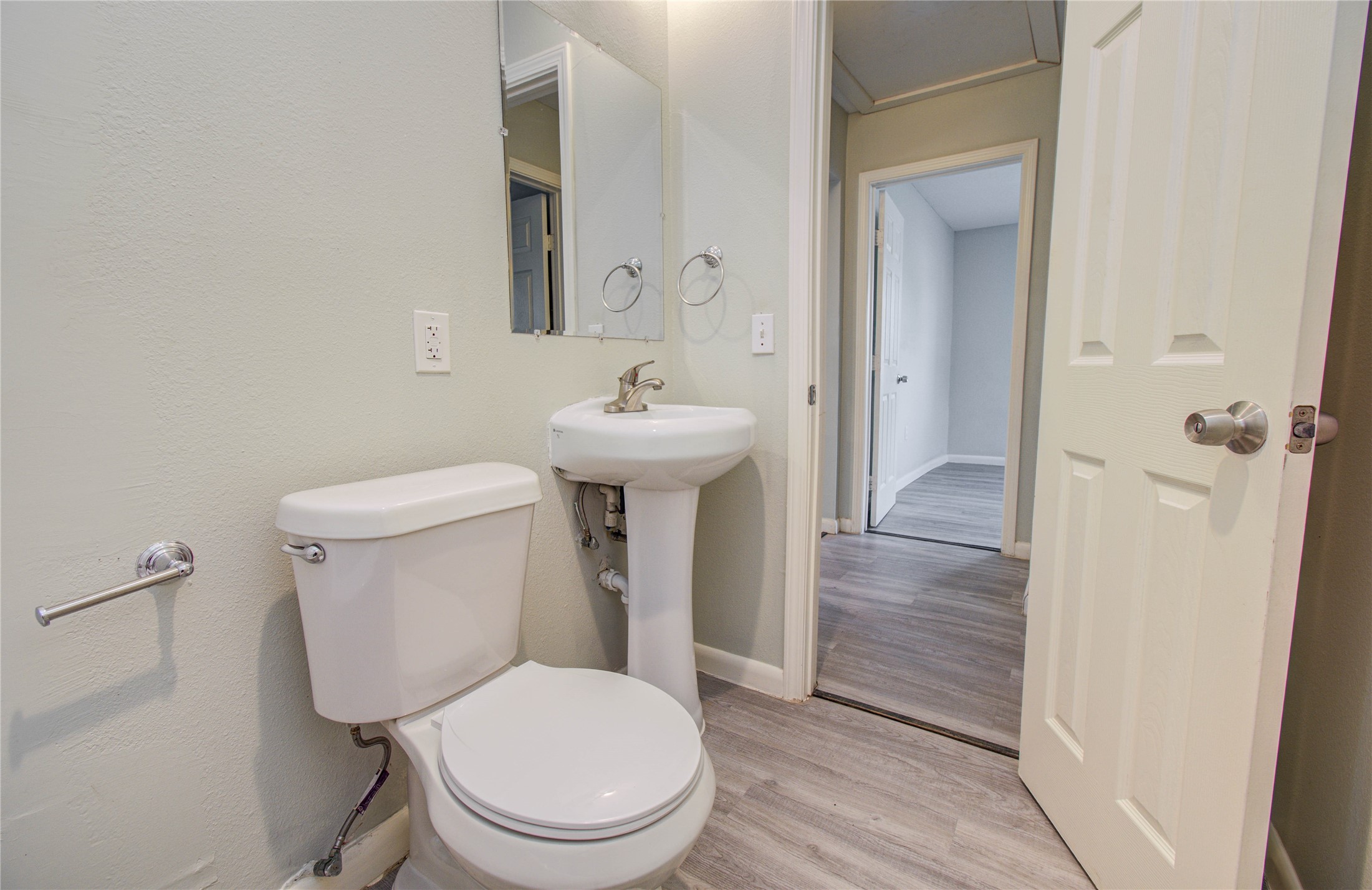 4624 Kingsbury Street Houston, TX 77021 - Photo 28 of 31 a white toilet sitting next to a bathroom sink