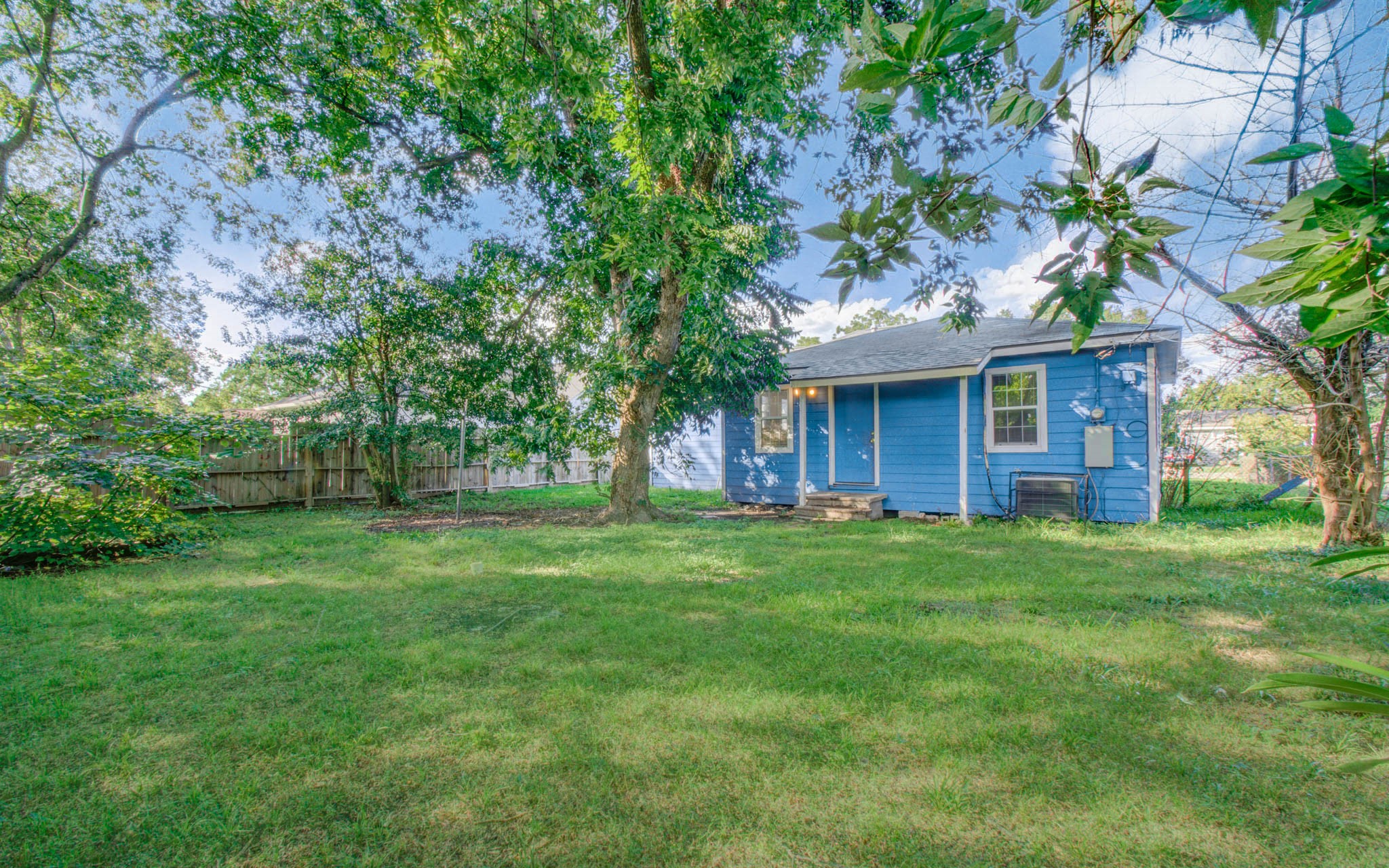 4624 Kingsbury Street Houston, TX 77021 - Photo 30 of 31 a view of a yard in front of a house with large trees
