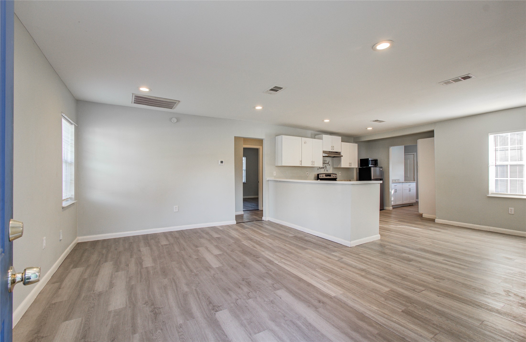 4624 Kingsbury Street Houston, TX 77021 - Photo 5 of 31 a view of kitchen with wooden floor and window
