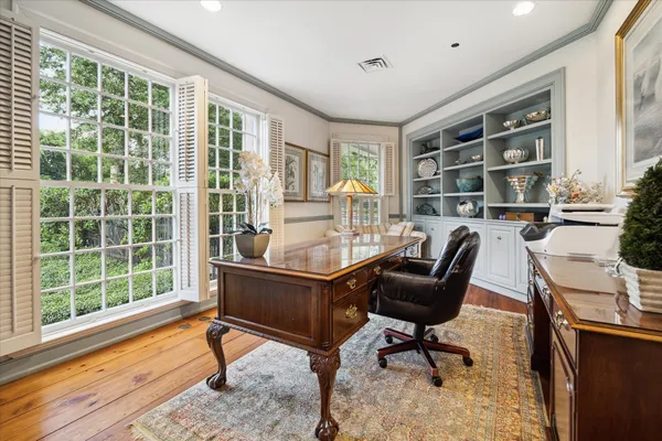 a work room with furniture and a window