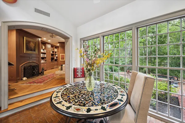 a view of a dining room with furniture window and outside view