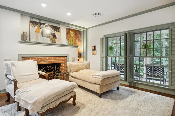 a spacious bedroom with two beds and large window
