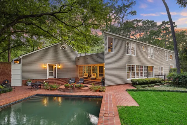 a front view of house with yard and outdoor seating