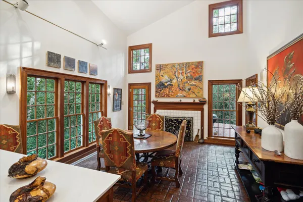 a living room with furniture and a floor to ceiling window