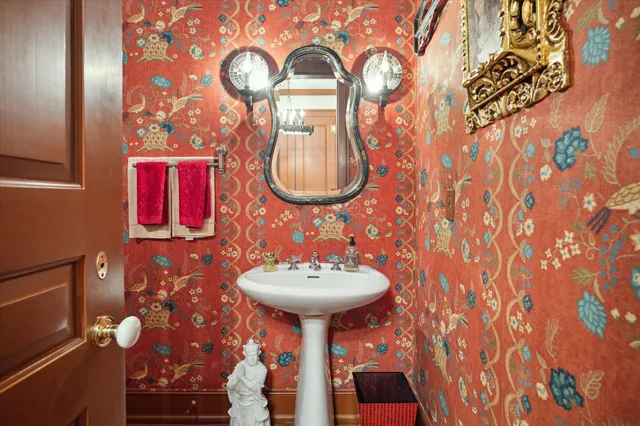 a bathroom with a sink and mirror