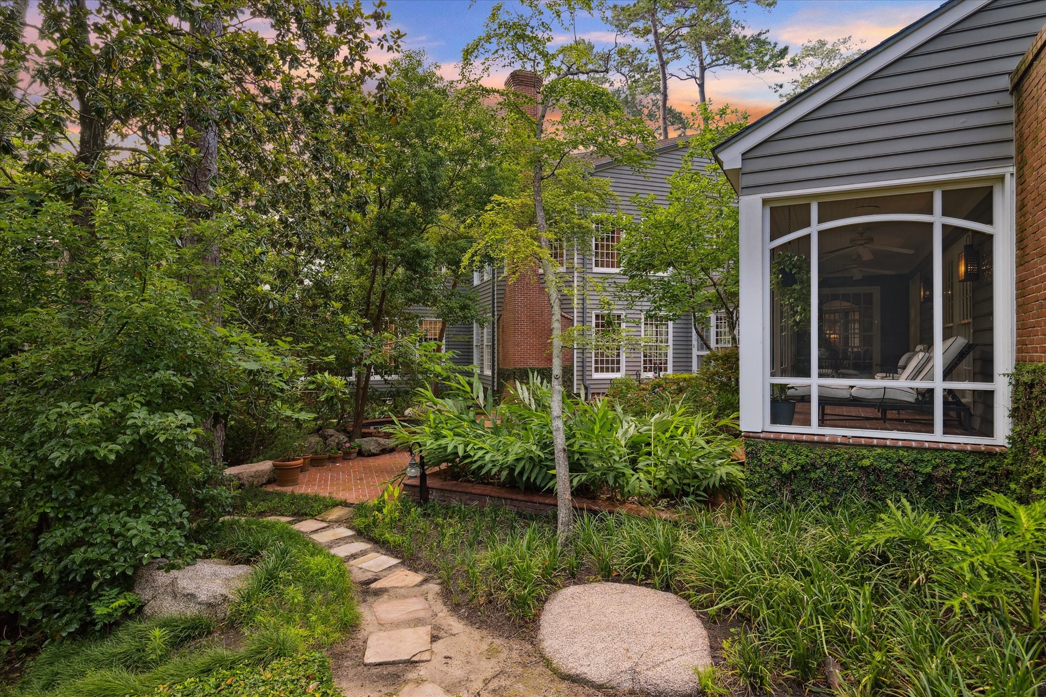 3971 Inverness Drive Houston, TX 77019 - Photo 45 of 50 a view of a garden with potted plants and a large tree